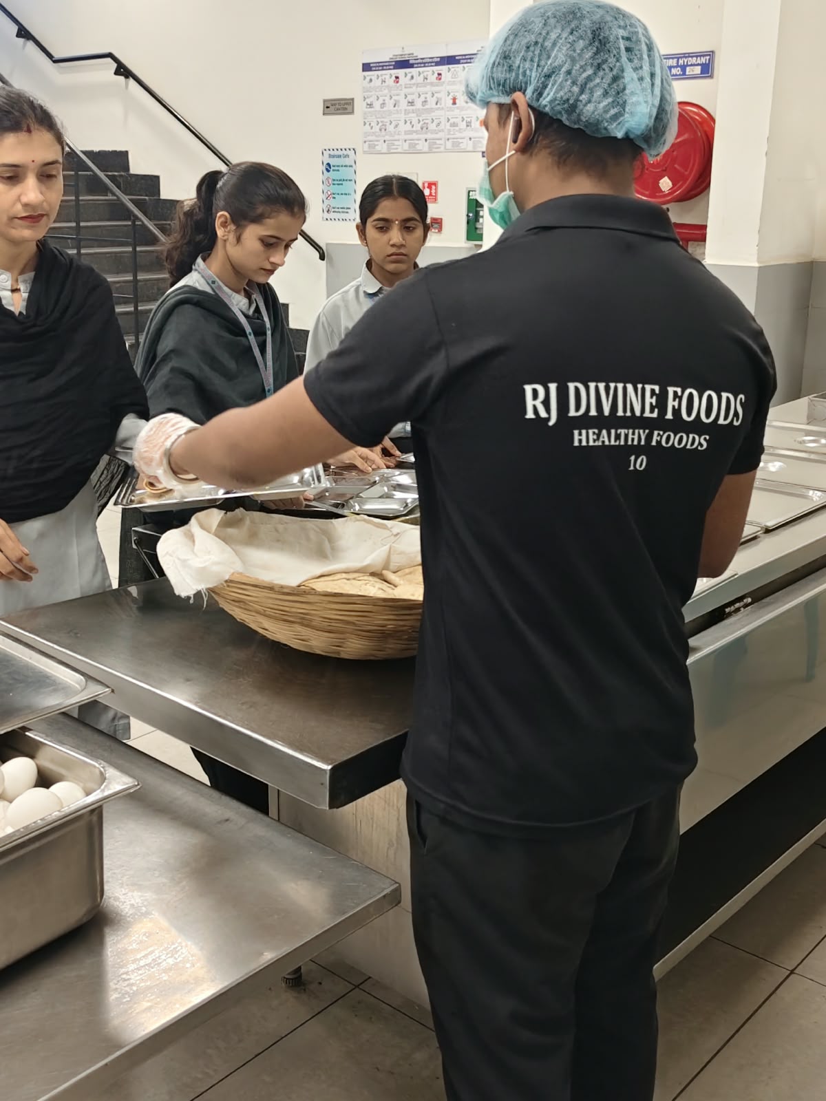 RJ Divine Foods staff at an industrial canteen counter